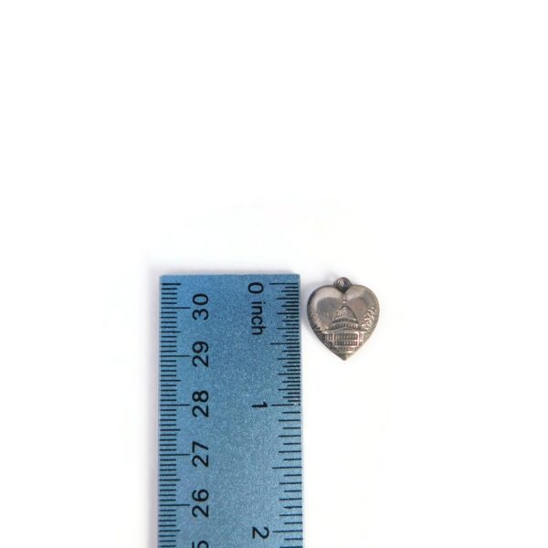 1940s heart charm with ruler for scale