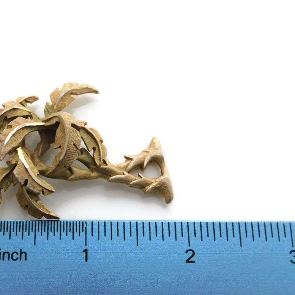 palm tree brooch with ruler for scale