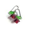 purple flower earrings with red centers and green leaves