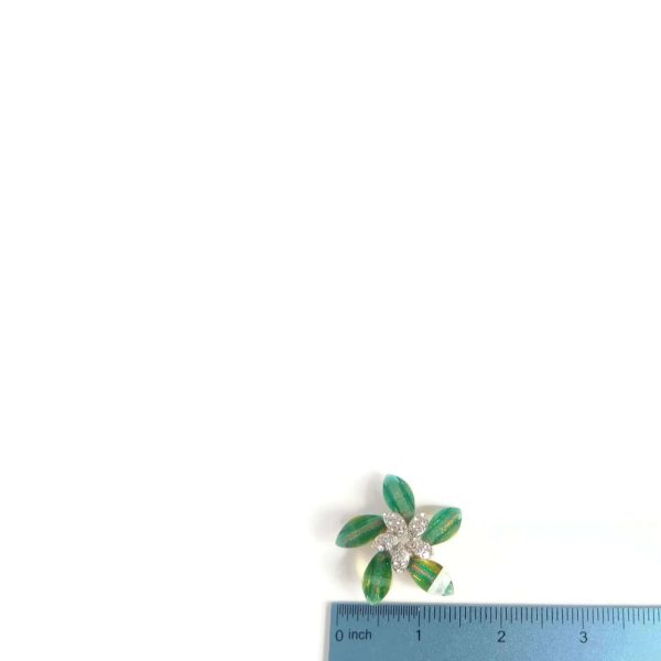 flower brooch with ruler for scale