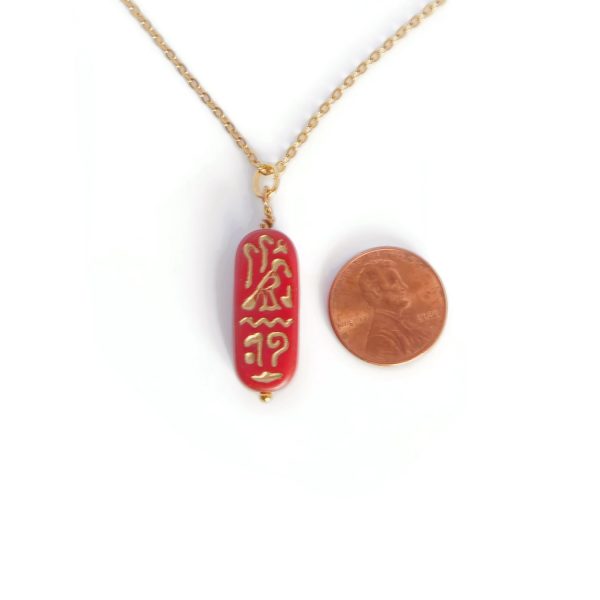 cartouche necklace with penny for scale