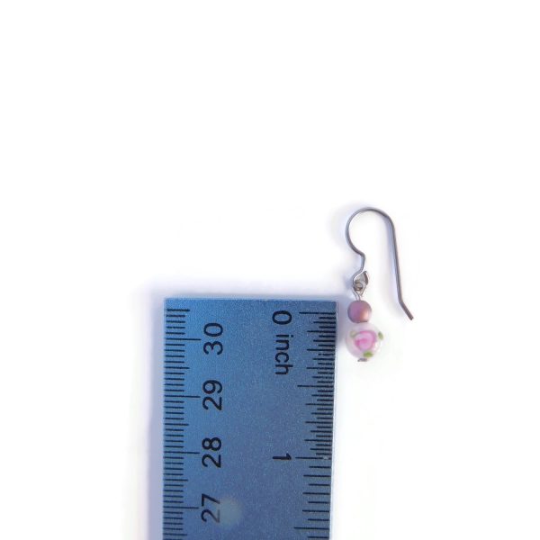 mini purple earrings with ruler for scale