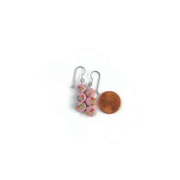 pink millefiori earrings with penny for scale