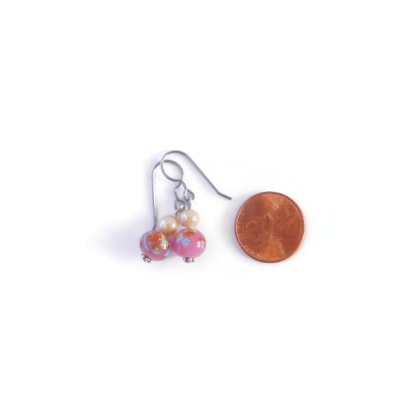 pink millefiori earrings with penny for scale