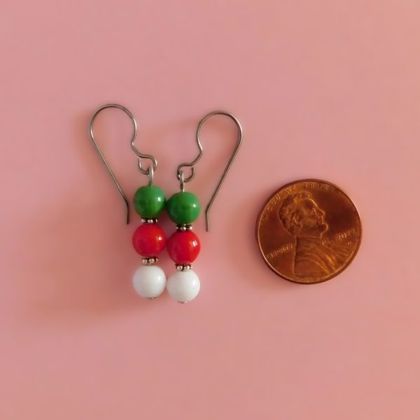 christmas earrings with penny for scale