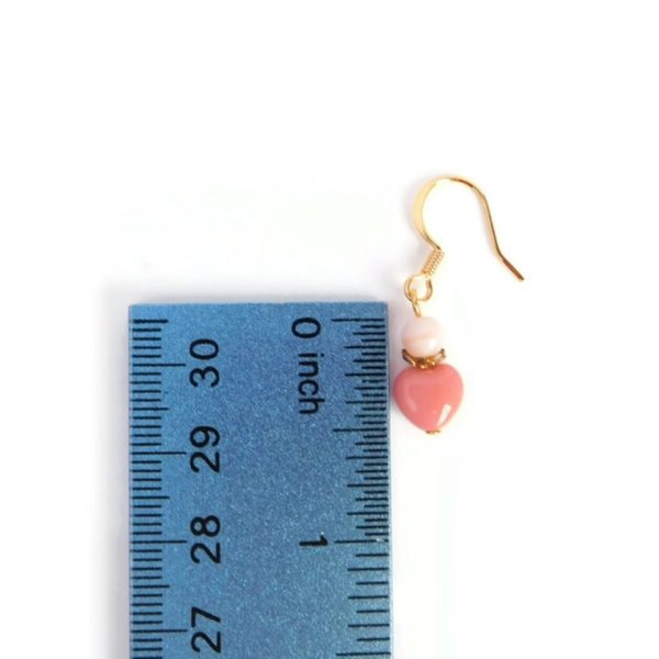 pink heart earrings with ruler for scale