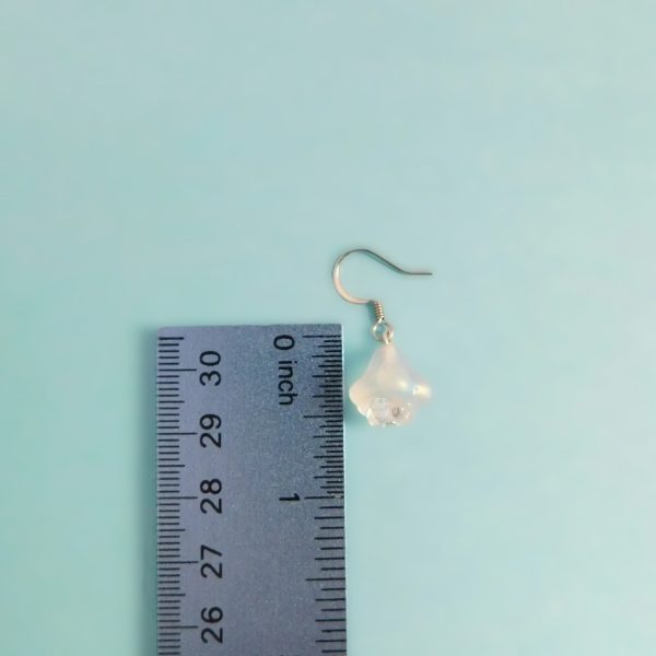 clear flower earrings with ruler for scale