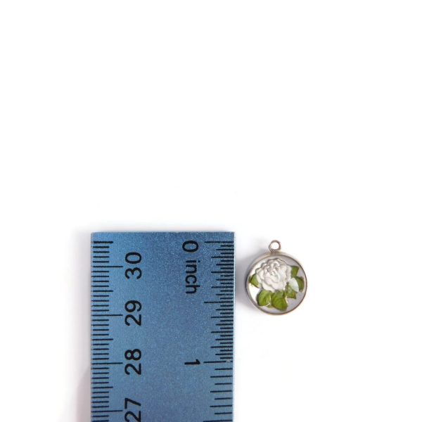rose charm with ruler for scale