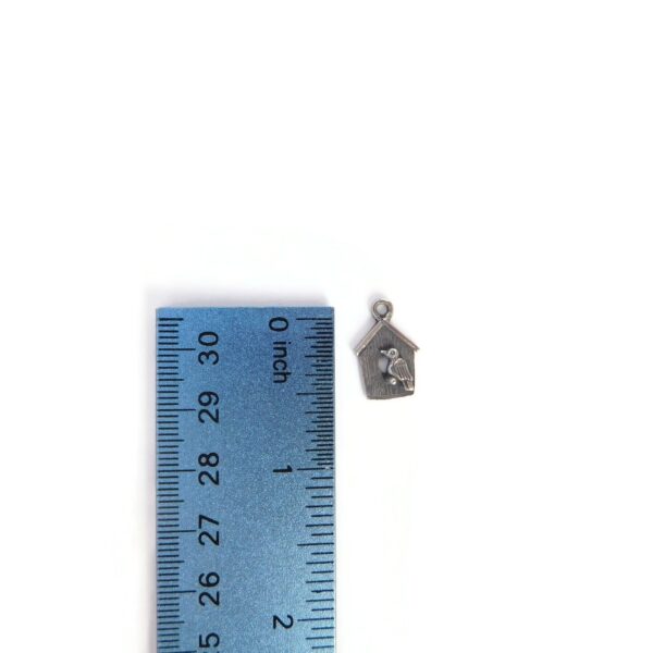 birdhouse charm with ruler for scale