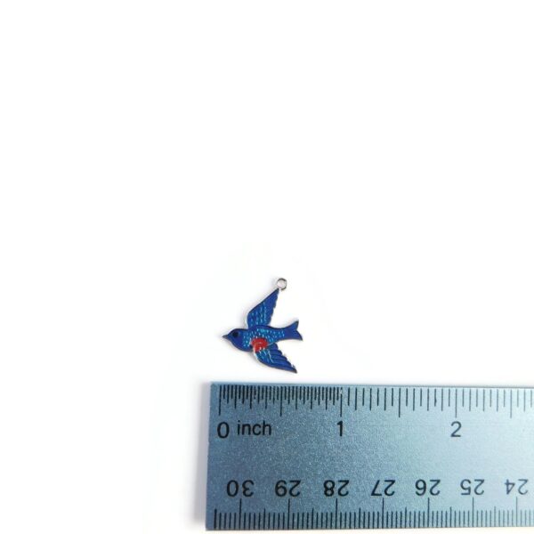 blue bird charm with ruler for scale