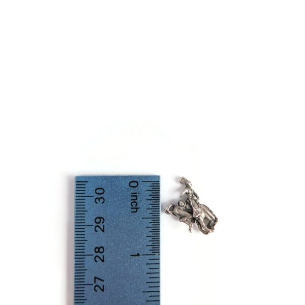 bucking bronco charm with ruler for scale