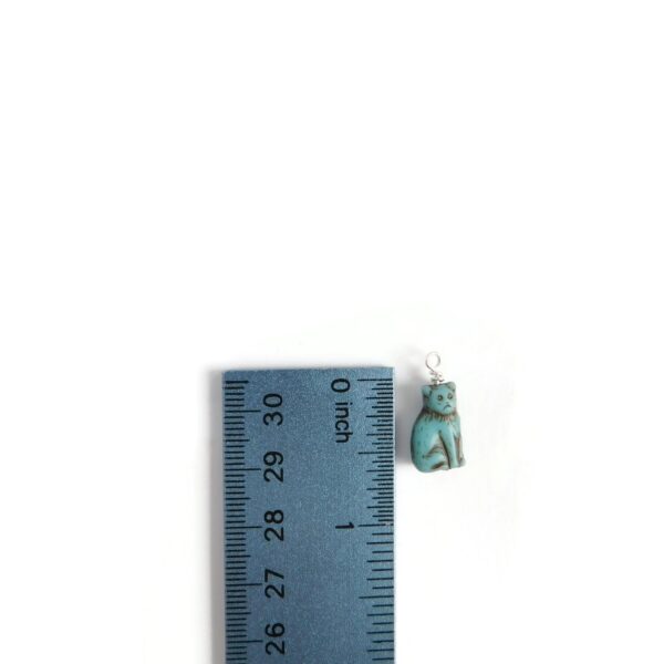 cat charm with ruler for scale