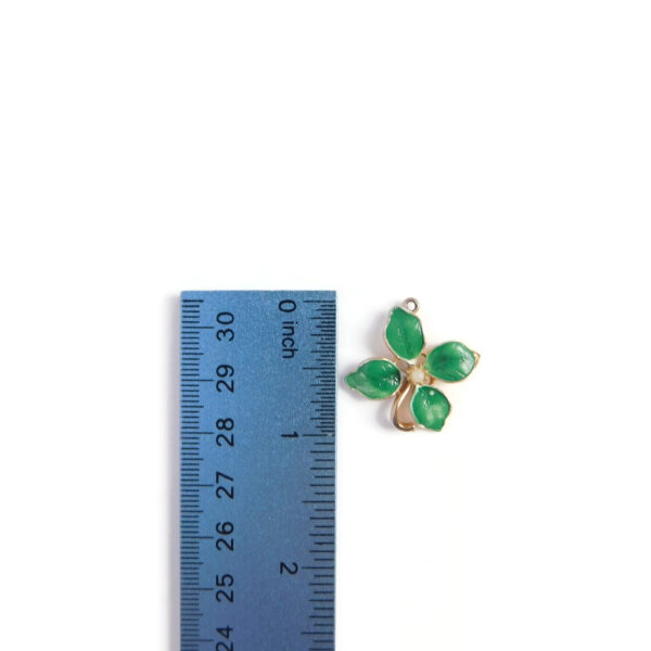 green flower charm with ruler for scale