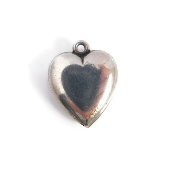 back of heart charm with 4 leaf clover