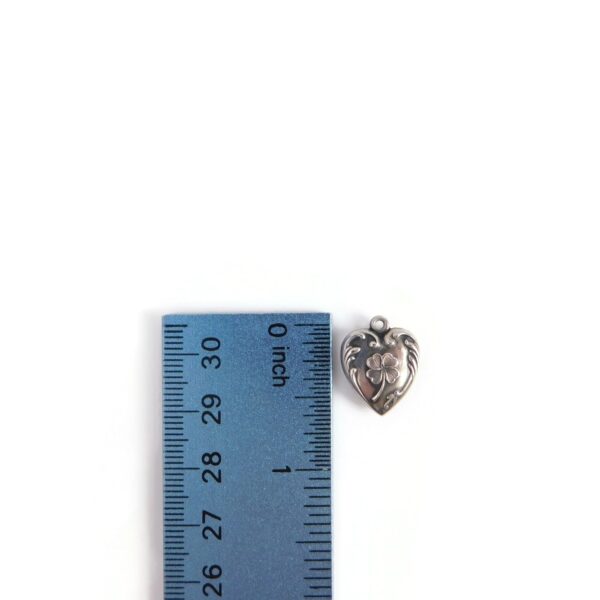 heart charm with 4 leaf clover with ruler for scale