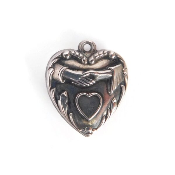 heart charm with hands