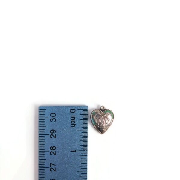 heart charm with palm tree with ruler