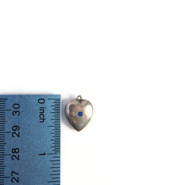 heart charm with stone with ruler for scale
