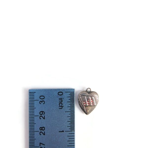 heart with flag charm with ruler for scale