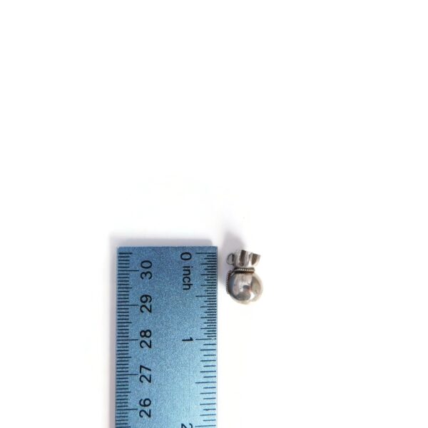 money bag charm with ruler for scale