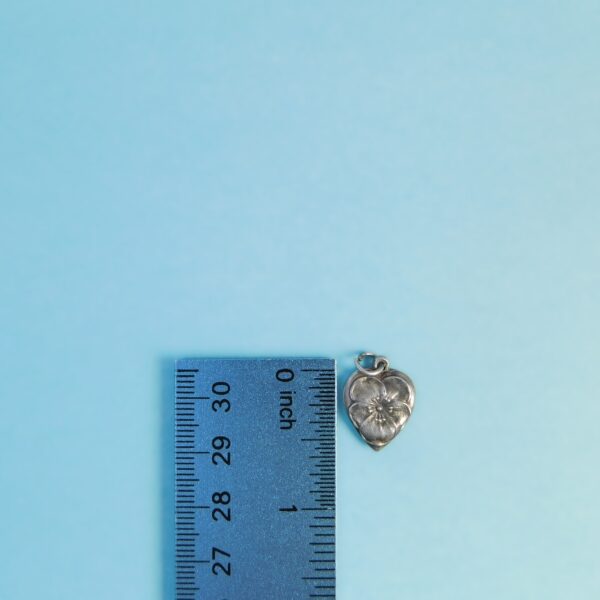 pansy heart charm with ruler for scale