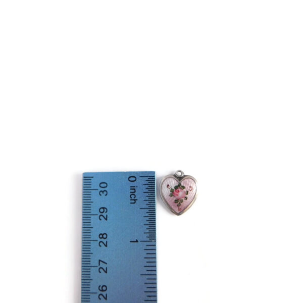 pink heart charm with ruler for scale