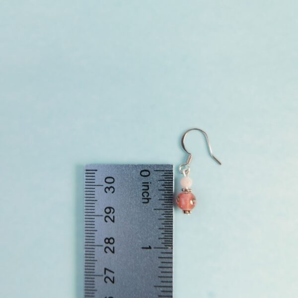 pink lampwork earrings with ruler for scale