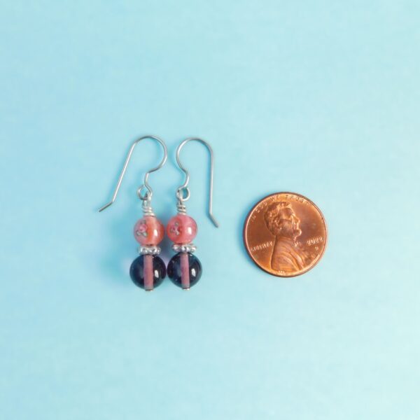 pink purple earrings with penny for scale