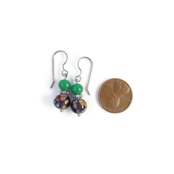 purple and green earrings with penny for scale