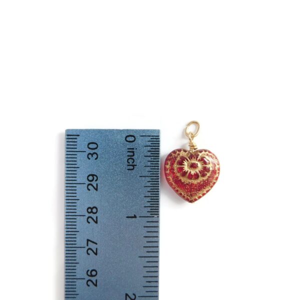 red heart pendant with ruler for scale