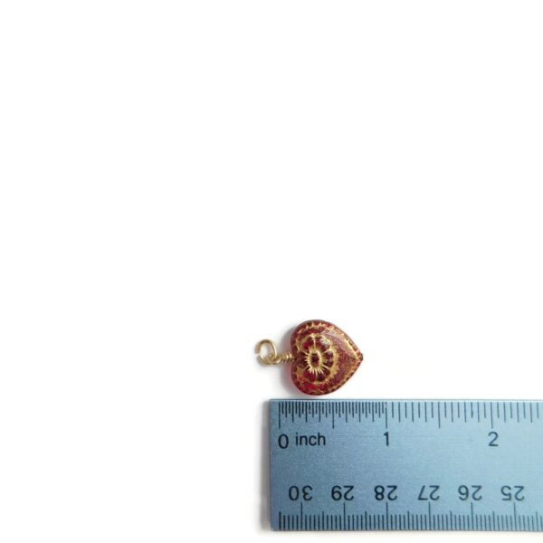 red heart pendant with ruler for scale