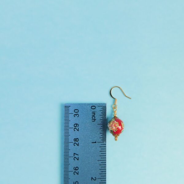 red tensha bead earrings with ruler for scale