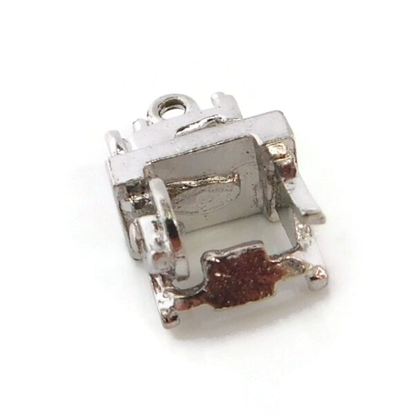bottom of sewing machine charm