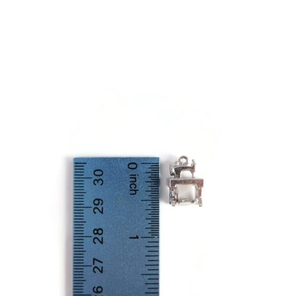 sewing machine charm with ruler for scale