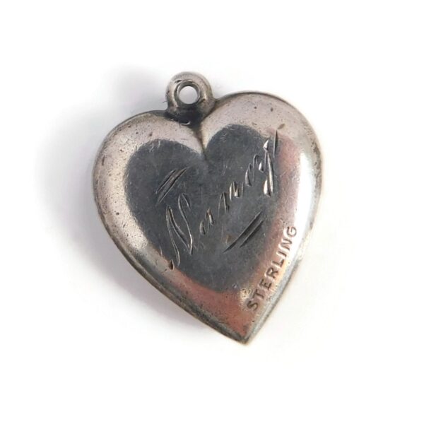 back of silver puffy heart charm
