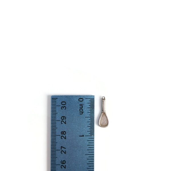 tennis racket charm with ruler for scale