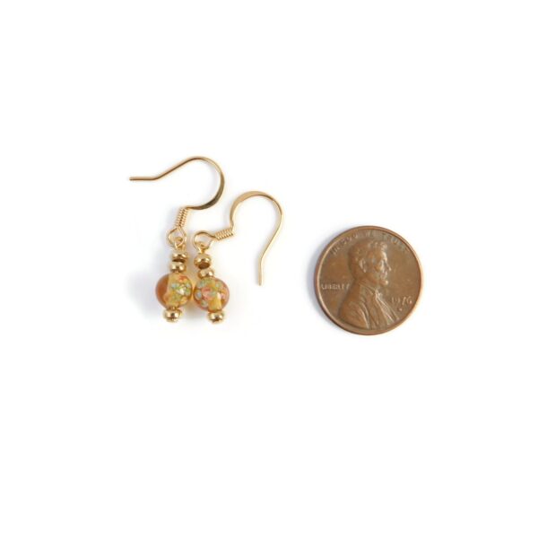 yellow earrings with penny for scale