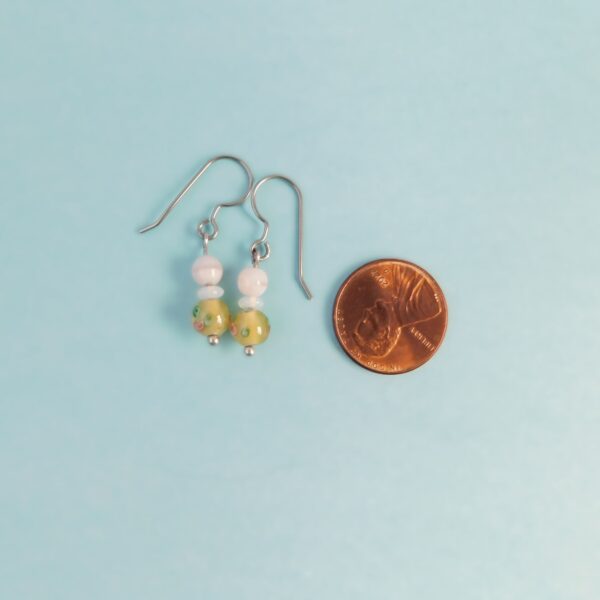 yellow lampwork earrings with penny for scale
